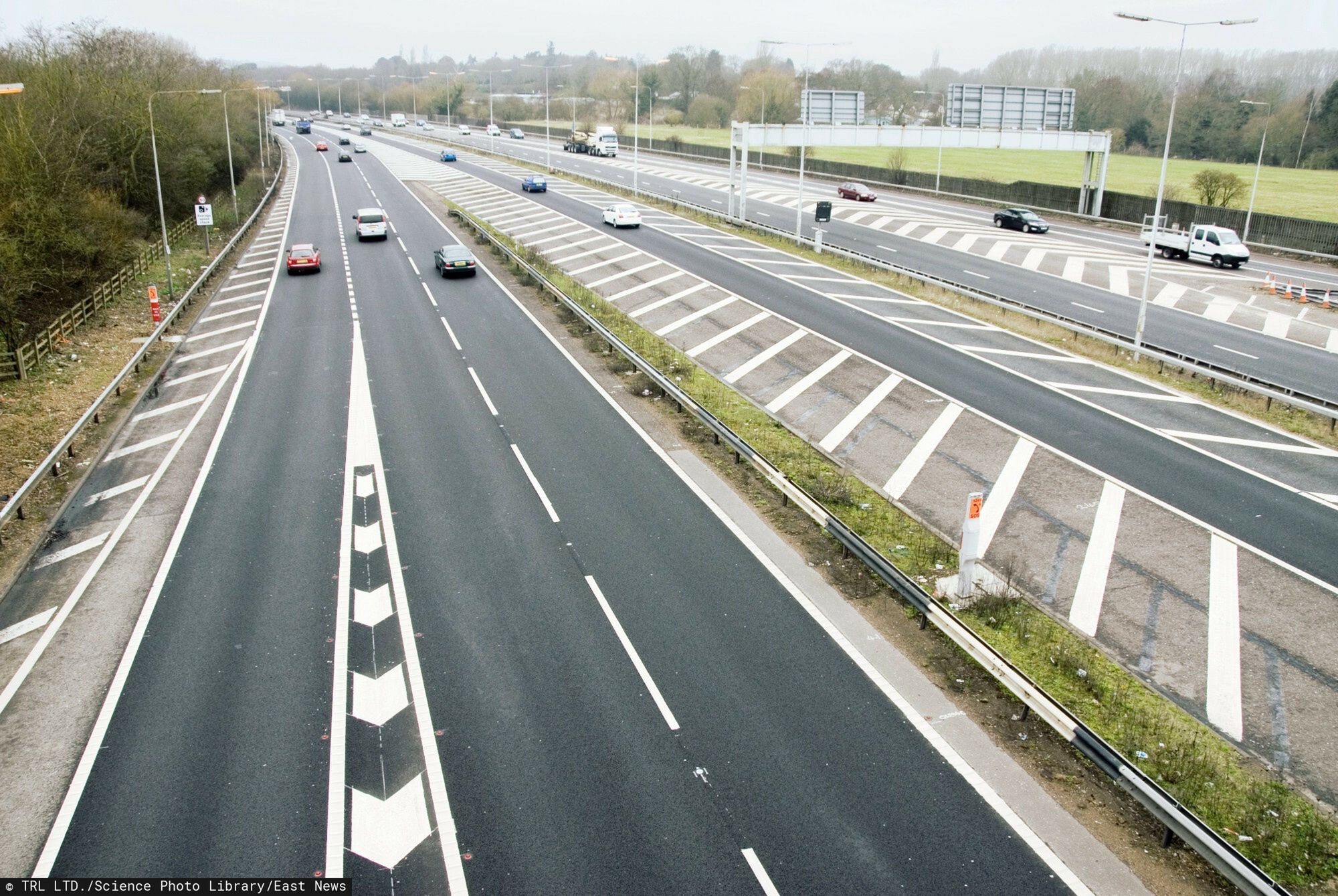 SPL RM HD
Motorway junction. At left is the slip road leading from the clockwise (A) carriageway of the M25 motorway onto the south-westbound (A) carriageway of the M3 motorway. The M3 (both carriageways seen at right) is part of the UK motorway network, and runs from Sunbury-on-Thames, Surrey, to Southampton, Hampshire. The M25 is the orbital motorway surrounding Greater London. The two motorways meet at junction 2 of the M3, which is also junction 12 of the M25. This photograph was taken from Lyne Lane.
TRL LTD.