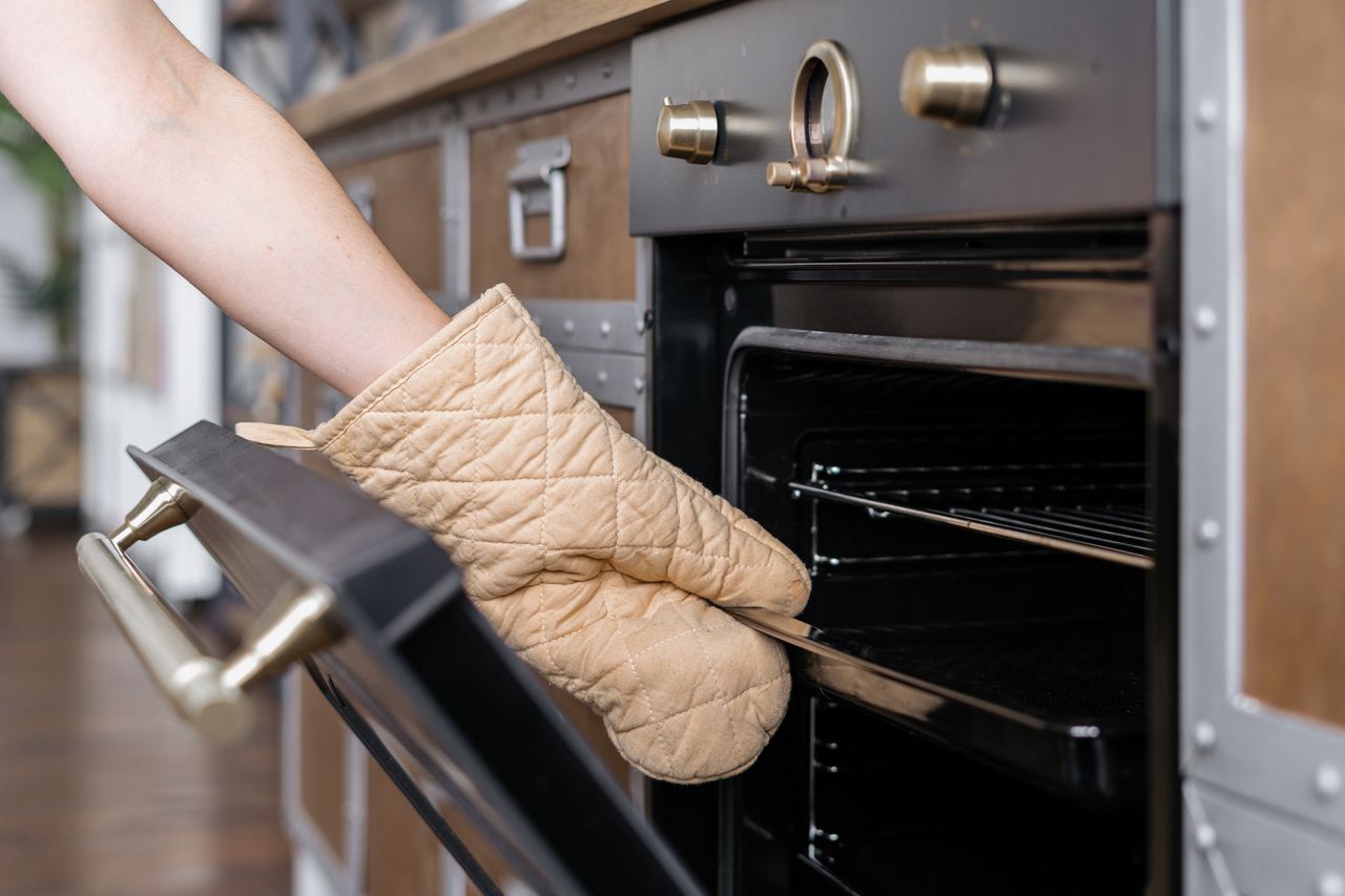 Hidden oven button unlocks safety, cleaning benefits