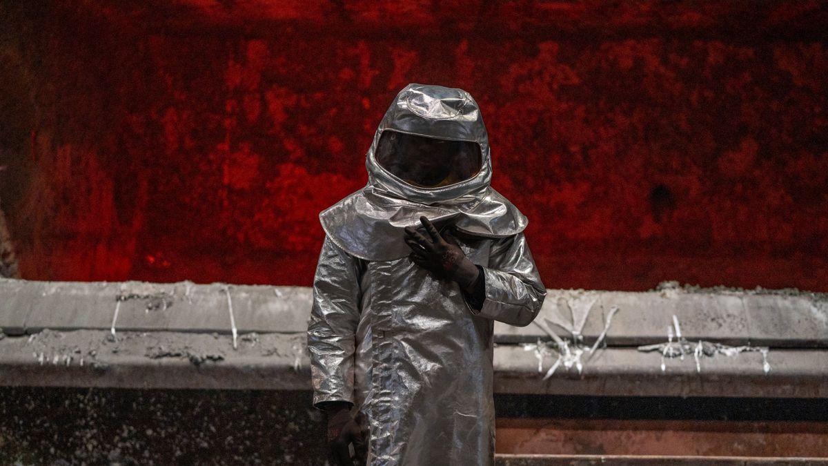 A worker in the foundry at the Aluminum Dunkerque SAS aluminium smelter near Dunkirk, France, on Monday, March 17, 2025. After weeks of uncertainty that ricocheted through markets, President Trump's 25% tariffs on steel and aluminum imports from every country in the world went into effect on Wednesday morning. Photographer: Nathan Laine/Bloomberg via Getty Images