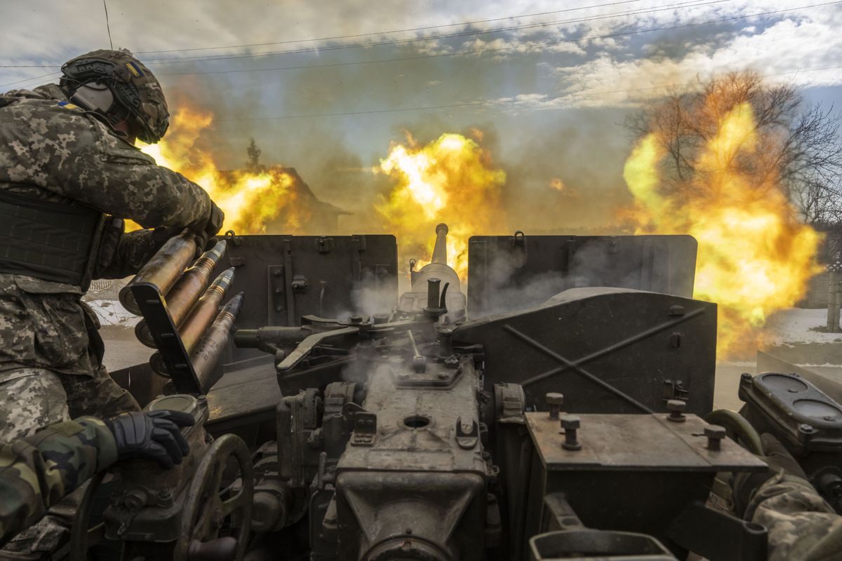 BAKHMUT, UKRAINE - APRIL 02: Ukrainian servicemen fire an artillery shell near the frontline area amid the Russia-Ukraine war, in Bakhmut, Ukraine on April 02, 2023. (Photo by Muhammed Enes Yildirim/Anadolu Agency via Getty Images)