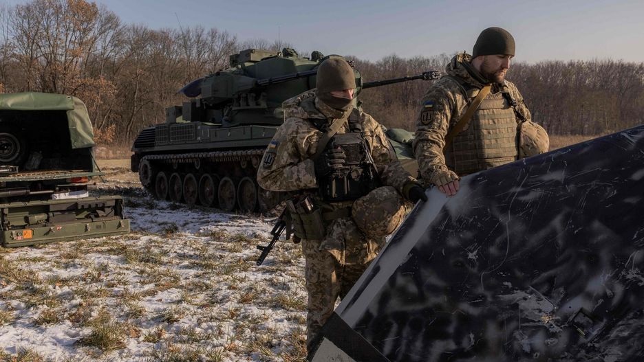 Ukrai?scy ?owcy dron�w
Ukrainian servicemen of a drone hunting team show to the media a part of an allegedly downed painted black  Russian launched drone next to a German Gepard anti-aircraft-gun tank, in the outskirts of Kyiv, on November 30, 2023, amid the Russian invasion of Ukraine. Members of the drone hunting team gathered to receive a military award for their actions in shooting down drones on November 25, when Ukraine said they had downed 74 out of 75 drones that Russia launched at it, in what it said was the biggest such attack since the start of the invasion. The Ukrainian army said that day Russia had launched a "record number" of Iranian-made Shahed drones, the majority of which targeted Kyiv. (Photo by Roman PILIPEY / AFP)
ROMAN PILIPEY