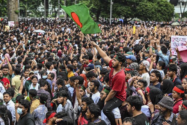 A Bangladeshi student is waving a flag during the Anti-Discrimination Student Movement rally at Central Shaheed Minar in Dhaka, Bangladesh, on August 3, 2024, to demand justice for the victims killed in the recent countrywide violence during anti-quota protests. Student leaders are rallying Bangladeshis on August 3 for a nationwide civil disobedience campaign as Prime Minister Sheikh Hasina's government is weathering a worsening backlash over a deadly police crackdown on protesters. (Photo by Zabed Hasnain Chowdhury/NurPhoto via Getty Images)