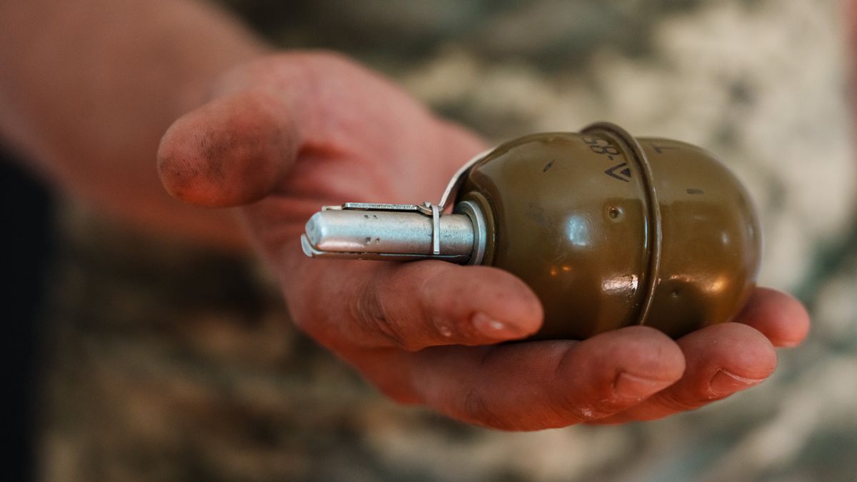 PIDDUBNE, UKRAINE -- JUNE 4, 2022: Artem ÒSaviour,Ó 42, whose last name withheld for security, 42, shows his closet cupboard that is filled with weapons, nearby Piddubne, Ukraine, Saturday, June 4, 2022. (MARCUS YAM / LOS ANGELES TIMES)