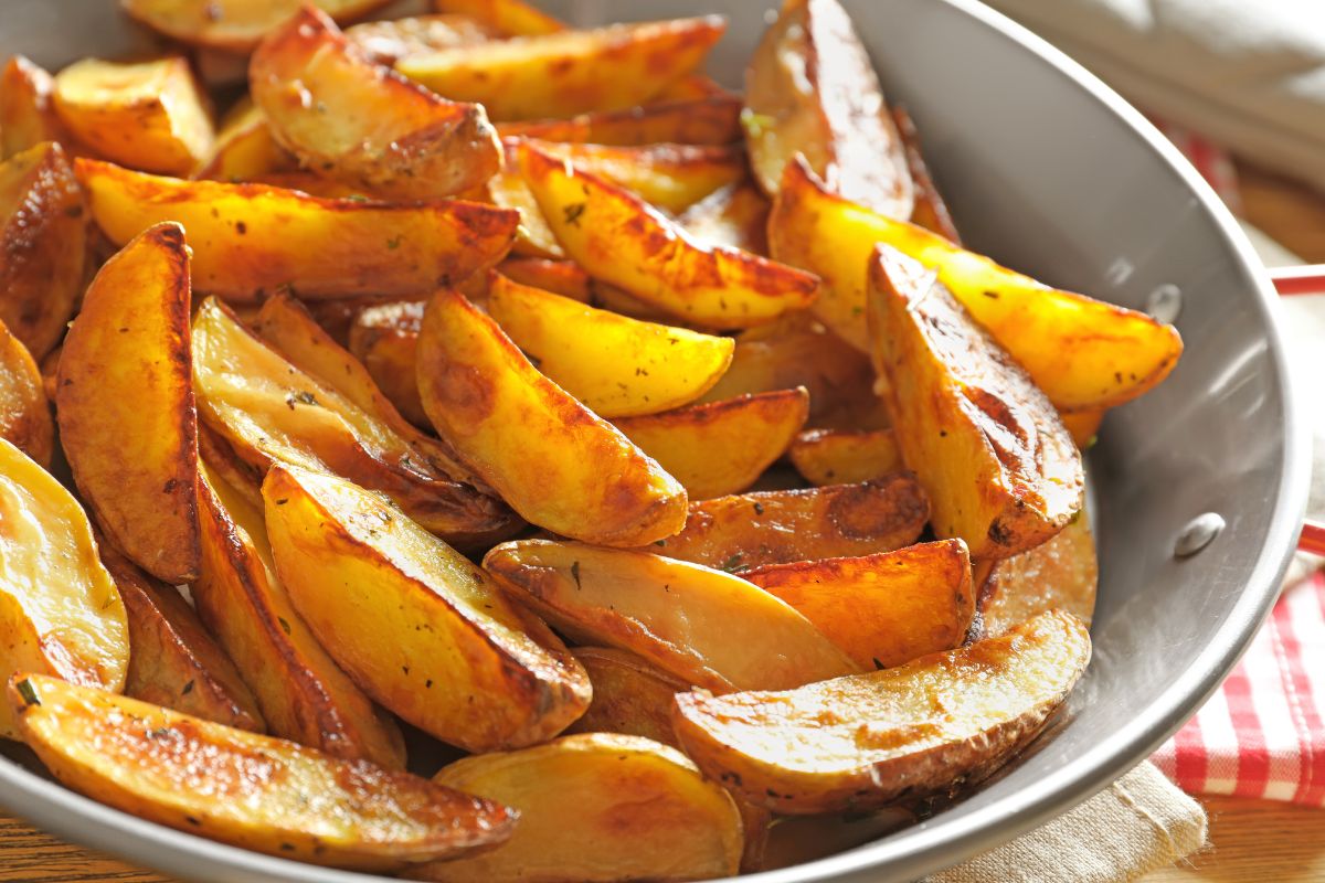Roast the potatoes with a special mix of spices. They will be tasty and crunchy.