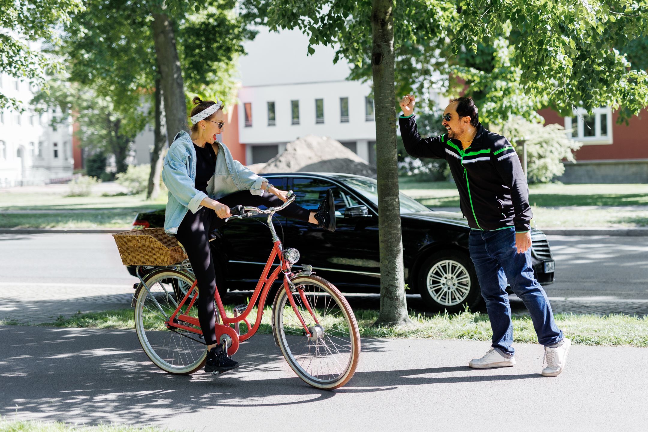 Man gestures angrily toward woman riding red bicycle on sidewalk, suggesting conflict in shared urban space. Scene shows tension between cyclist and pedestrian under trees on sunny day
Man gestures angrily toward woman riding red bicycle on sidewalk, suggesting conflict in shared urban space. Scene shows tension between cyclist and pedestrian under trees on sunny day.
woman, man, girl, bike, spring, summer, young, conflict, bicycle, pedestrian, sidewalk, urban, shouting, cycling, danger, city, path, emotion, traffic, street, law, safety, rules, anger, ride, walking, lane, gesture, dispute, scene, reaction, stop, meeting, incident, stress, problem, accident, movement, warning, vintage, cyclist, park, nature, riding, lifestyle, cycle, people, lady, casual, outdoors, woman, man, girl, bike, spring, summer, young, conflict, bicycle, pedestrian, sidewalk, urban, shouting, cycling, danger, city, path, emotion, traffic, street, law, safety, rules, anger, ride, walking, lane, gesture, dispute, scene, reaction, stop, meeting, incident, stress, problem, accident, movement, warning, vintage, cyclist, park, nature, riding, lifestyle, cycle, people, lady, casual, outdoors