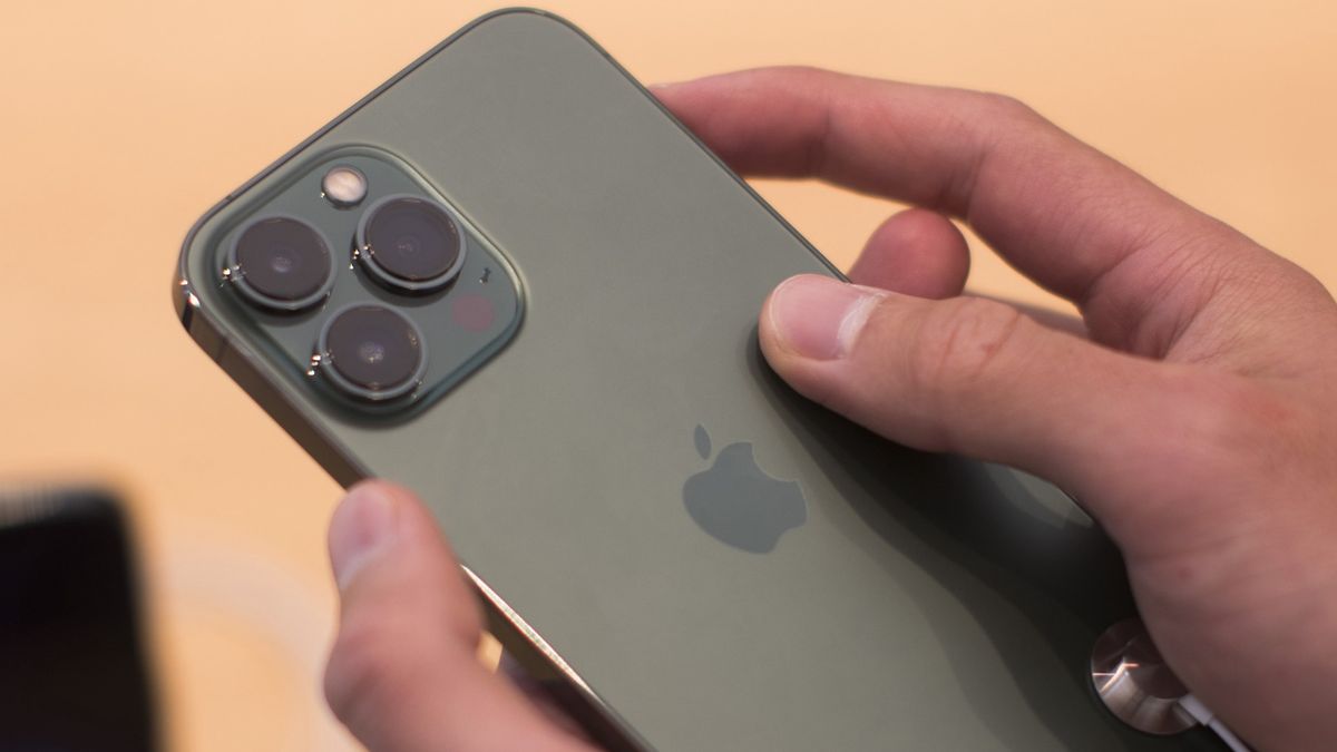 An Apple Inc. iPhone 13 Pro smartphone at one of the company's stores in Sydney, Australia, on Friday, March 18, 2022. The debut of Apple's latest iPhone brings a change to the way its U.S. customers can purchase the device, a move toward cutting wireless carriers out of the process and giving the tech giant more control. Photographer: Brent Lewin/Bloomberg via Getty Images