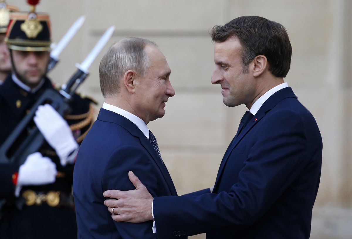PARIS, FRANCE - DECEMBER 09: French President Emmanuel Macron welcomes Russian President, Vladimir Putin as he arrives at the Elysee Presidential Palace to attend a summit on Ukraine on December 09, 2019 in Paris, France. This quadripartite summit in the so-called ‘Normandy’ format is being held today in Paris to discuss the situation in Ukraine in the presence German Chancellor Angela Merkel, Ukrainian President Volodymyr Zelensky, French President Emmanuel Macron and Russian President Vladimir Putin. (Photo by Chesnot/Getty Images)
