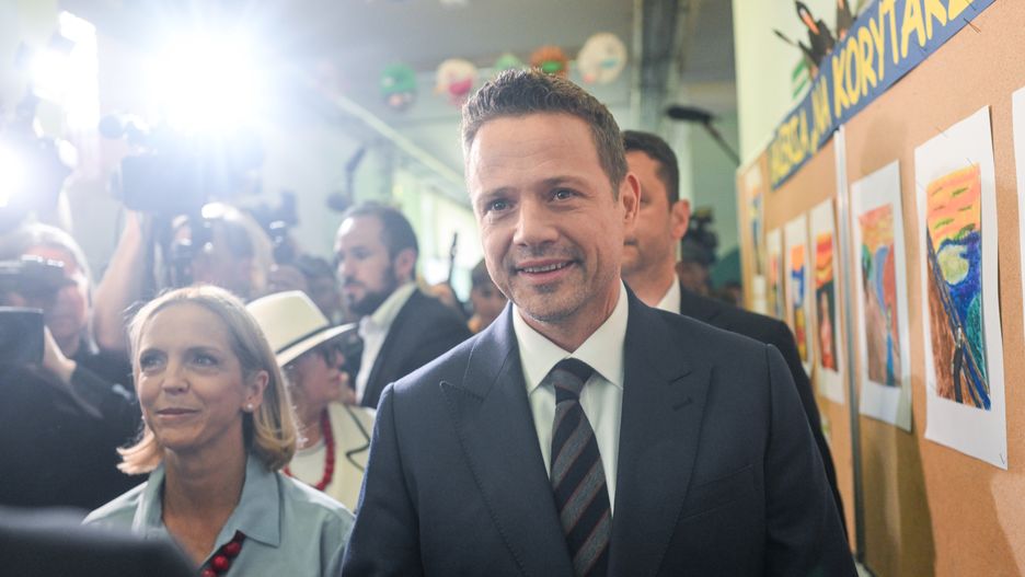 WARSAW, POLAND - JUNE 01: The Mayor of Warsaw and the Civic Coalition (KO) presidential candidate, Rafal Trzaskowski and his wife Malgorzata leave the poll station after casting their ballot during the runoff of the presidential election on June 01, 2025 in Warsaw, Poland. Today's presidential runoff election is a closely contested race between Rafal Trzaskowski, the liberal mayor of Warsaw who is supported by Prime Minister Donald Tusk, and Karol Nawrocki of the Law and Justice Party (PiS), which has held the presidency since 2015. The election is seen as a test of whether the government, with its centrist parliamentary coalition, can overcome the right-wing populism embodied by PiS. (Photo by Omar Marques/Getty Images)