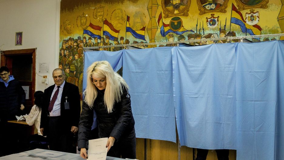 Temporary
A woman, backdropped by a wallpaper depicting historical characters, casts her vote in the country's parliamentary elections, in Buzau, Romania, Sunday, Dec. 1, 2024. (AP Photo/Bogdan Buda)
Bogdan Buda