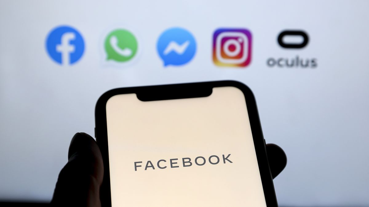 ANKARA, TURKEY - MAY 4: In this illustration photo, Facebook logo is displayed on a smart phone as logo of social media applications  Facebook, WhatsApp, Instagram, Messenger and Oculus are seen behind, in Ankara, Turkey on May 4, 2020. (Photo by Hakan Nural/Anadolu Agency via Getty Images)