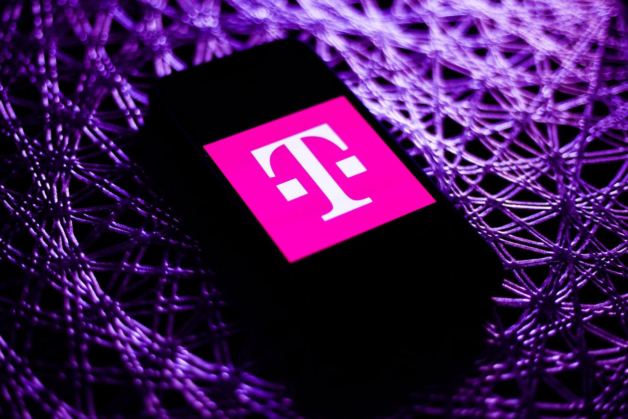 T-Mobile logo is seen displayed on a phone screen in this illustration photo taken in Poland on November 19, 2020. (Photo by Jakub Porzycki/NurPhoto via Getty Images)