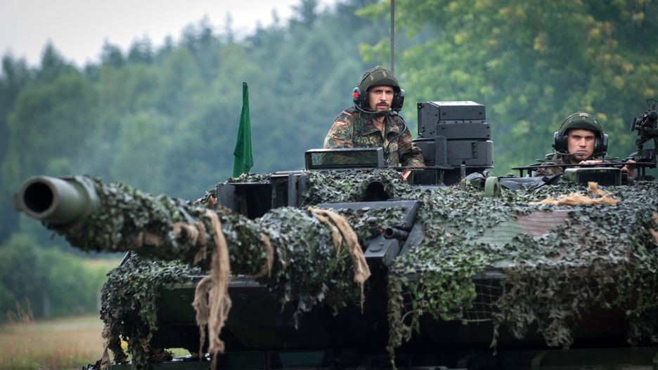 BERGEN-LOHHEIDE, GERMANY - JUNE 21:  Soldier's commanding their tank crew from the open turret's of a  Leopard 2 A6MA2 main battle tank at the Panzerbattalion 414 firing grounds on Lueneburg Heath, Bergen-Lohheide, Lower Saxony, Germany on June 21, 2018. Panzerbattalion 414 (Tank Battalion 414) is Europe's first integrated Battalion made up of Soldiers from 2 nations-Germany and Netherlands. The mixed Battalion of Dutch and German armies, Bundeswehr and Landmacht, operate as mixed crews and is officially part of the Bundeswehr (German Army). One in four out of 400 soldiers in Panzerbattalion 414  are Dutch from the Royal Netherlands Army. (Photo by Craig Stennett/Getty Images)