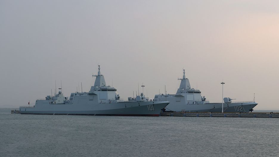 QINGDAO, CHINA - APRIL 20: The Type 055 guided-missile destroyer Nanchang (101) (L) and the Type 055 guided-missile destroyer Lhasa (102) are seen at Qingdao Port ahead of an activity to celebrate the 74th anniversary of the founding of the Chinese People's Liberation Army Navy (PLAN) on April 20, 2023 in Qingdao, Shandong Province of China. (Photo by Fu Tian/China News Service/VCG via Getty Images)