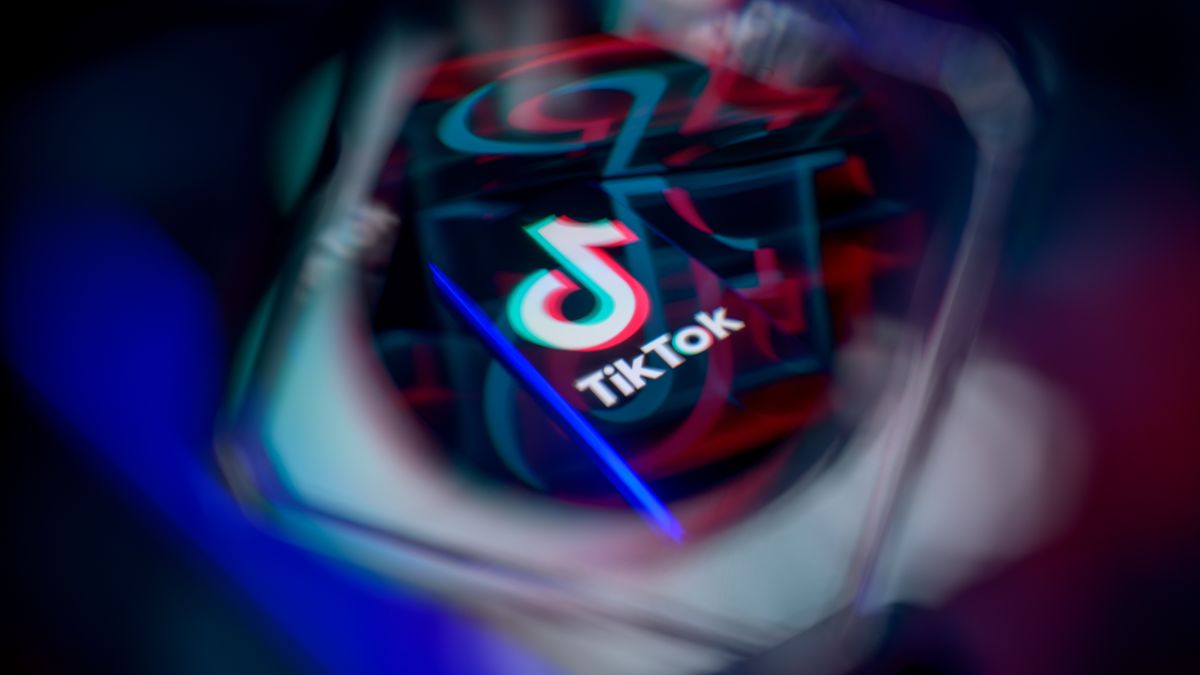 The TikTok logo is displayed on a smartphone screen in this photo illustration in Brussels, Belgium, on March 30, 2026. The platform faces regulatory scrutiny in Europe regarding concerns about design features and potential impacts on children's mental health under the EU's Digital Services Act. (Photo by Jonathan Raa/NurPhoto via Getty Images)