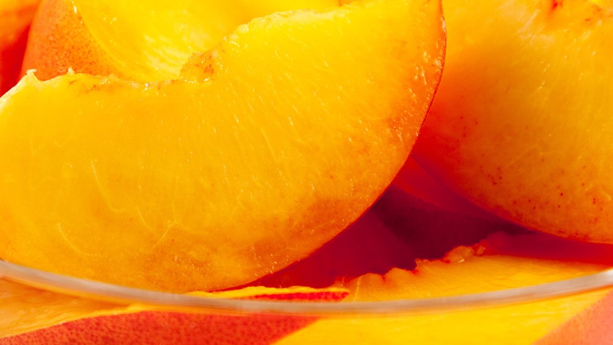 Bowl of Sliced PeachesBowl of fresh sliced peaches aa shallow depth of field.HelpingHandPhotos"Glass Bowl, Close-up, Food And Drink, Freshness, Fruit, Fruits And Vegetables", Group of Objects, Healthy Eating, Juicy, Nobody, Nutrient, Orange, Part Of, Peach, Photography, Portion, Ripe, Snack, Square, Studio Shot