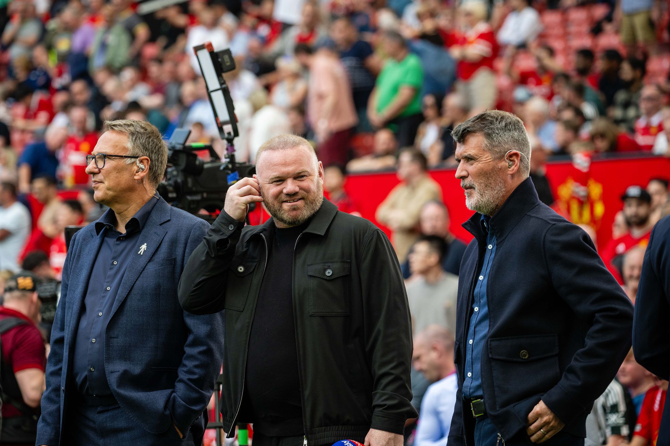 MANCHESTER, ENGLAND - MAY 12: Sky Sports pundit Paul Merson and Former Manchester United players and Sky Sports pundits Wayne Rooney and Roy Keane stand pitchside ahead of the Premier League match between Manchester United and Arsenal FC at Old Trafford on May 12, 2024 in Manchester, England. (Photo by Ash Donelon/Manchester United via Getty Images)