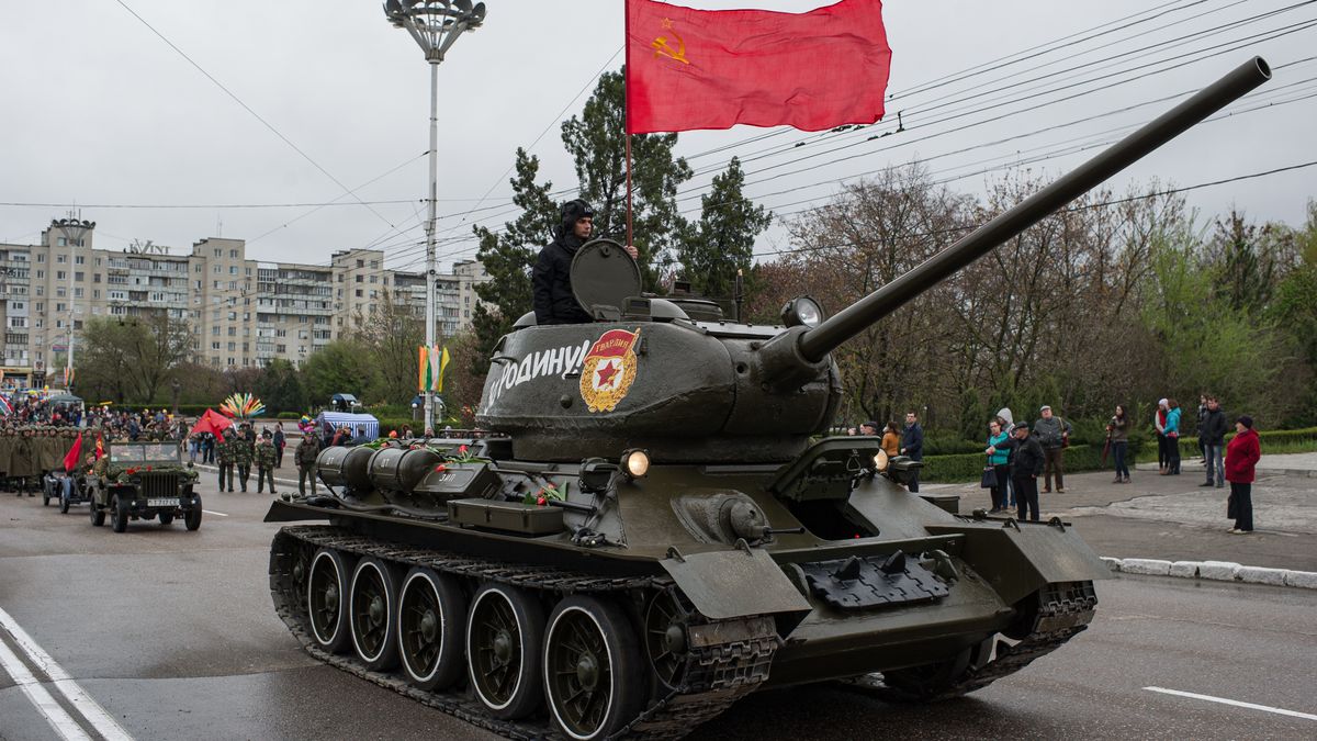 TIRASPOL, MOLDOVA - APRIL 12: A Soviet tank sperheads a parade during the celebration of the 70th anniversary of Tiraspol being taken by the Soviet Army during World War II, on April 12, 2014 in Tiraspol, Moldova. (Photo by Oleksii Furman/Getty Images)