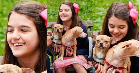 Szczęśliwa Suri Cruise przytula pieski na spacerze w parku