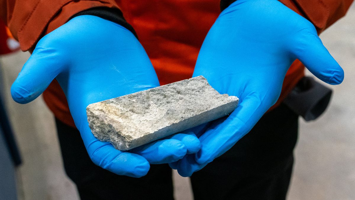 A worker holds a core sample with a low concentration of uranium at a core processing facility at NexGen Energy Ltd.'s Rook 1 project near Patterson Lake, Saskatchewan, Canada, on Tuesday, April 16, 2024. Prime Minister Justin Trudeau recently made uranium mining a key element of the country's net-zero emissions plan, an ironic twist for a leader who took office a decade ago pledging to shift the economy away from commodity extraction and all its harsh ups and downs. Photographer: Heywood Yu/Bloomberg via Getty Images