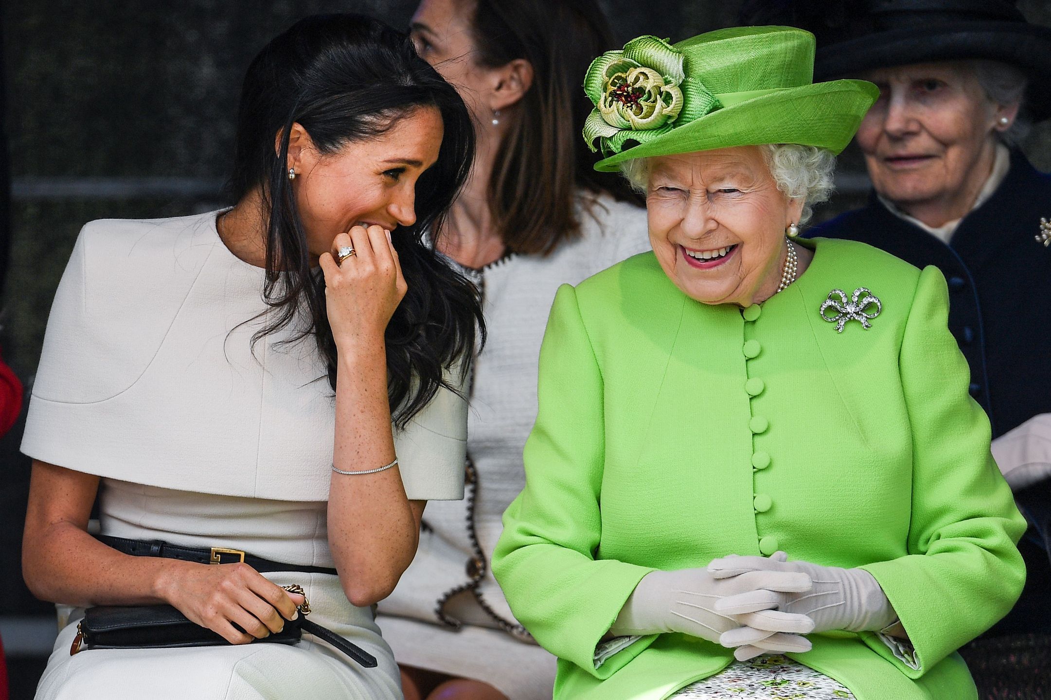 The Duchess Of Sussex Undertakes Her First Official Engagement With  Queen Elizabeth IICHESTER, ENGLAND - JUNE 14:  Queen Elizabeth II sitts and laughs with Meghan, Duchess of Sussex during a ceremony to open the new Mersey Gateway Bridge on June 14, 2018 in the town of Widnes in Halton, Cheshire, England. Meghan Markle married Prince Harry last month to become The Duchess of Sussex and this is her first engagement with the Queen. During the visit the pair will open a road bridge in Widnes and visit The Storyhouse and Town Hall in Chester.  (Photo by Jeff J Mitchell/Getty Images)Jeff J MitchellHuman Interest, Arts Culture and Entertainment, Royalty, People, Chester, FeedRouted_Global