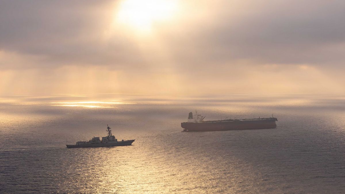ARABIAN SEA - 24 APRIL: (EDITOR'S NOTE: This Handout image was provided by a third-party organization and may not adhere to Getty Images' editorial policy.) In this handout photo provided by U.S. Central Command, Arleigh Burke-class guided-missile destroyer USS Rafael Peralta (DDG 115) implements a maritime blockade against an Iranian-flagged ship attempting to sail toward an Iranian port, on April 24, 2026 in the Arabian Sea. Rafael Peralta is deployed to the U.S. 5th Fleet area of operations to support maritime security and stability in the Middle East. (Handout photo by U.S. Navy via Getty Images)