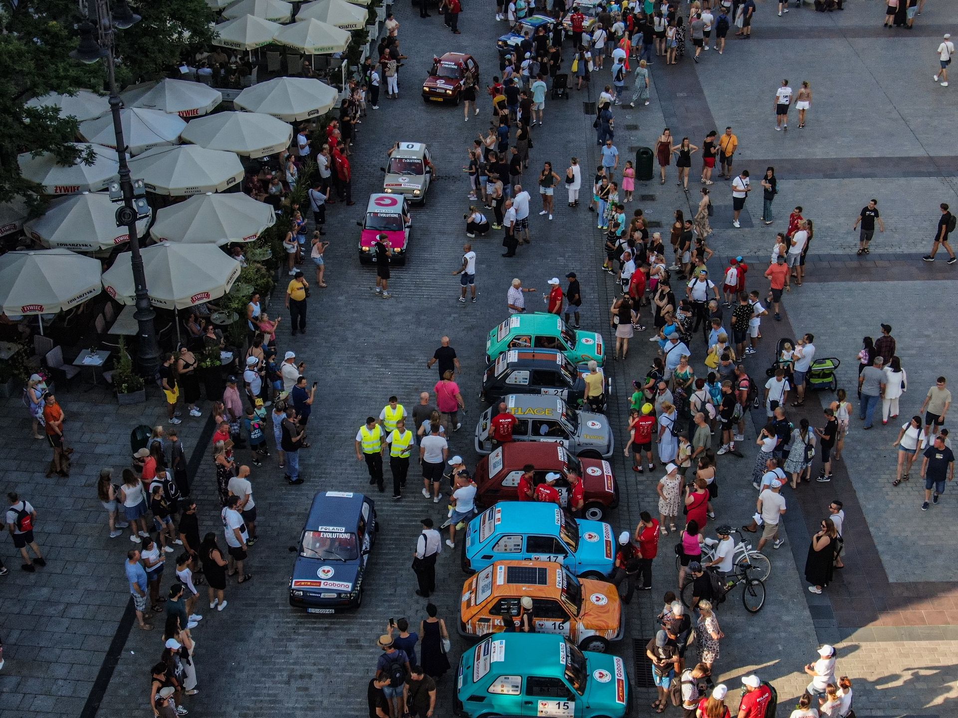 KRAKOW, POLAND - JULY 19: An aerial view of fiat 126 famous Polish communist times car during the final stage of driving around Europe to fundraise for Children injured in  road accidents in Krakow, Poland on July 19, 2024.  A group of 80 people drove  the famous little communist car for 3,553 km from Warsaw to Italy through Slovakia, Hungary, Romania, Serbia, Bosnia and Herzegovina and Croatia and collected over half million euros for Children injured in  road accidents (Photo by Omar Marques/Anadolu via Getty Images)