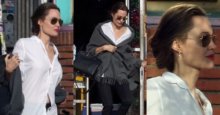 Wyniosła Angelina Jolie eksponuje dekolt w białej koszuli