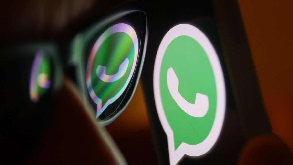 WhatsApp logo reflected on sunglasses and displayed on a phone screen is seen in this illustration photo taken in Poland on June 27, 2024. (Photo by Jakub Porzycki/NurPhoto via Getty Images)
