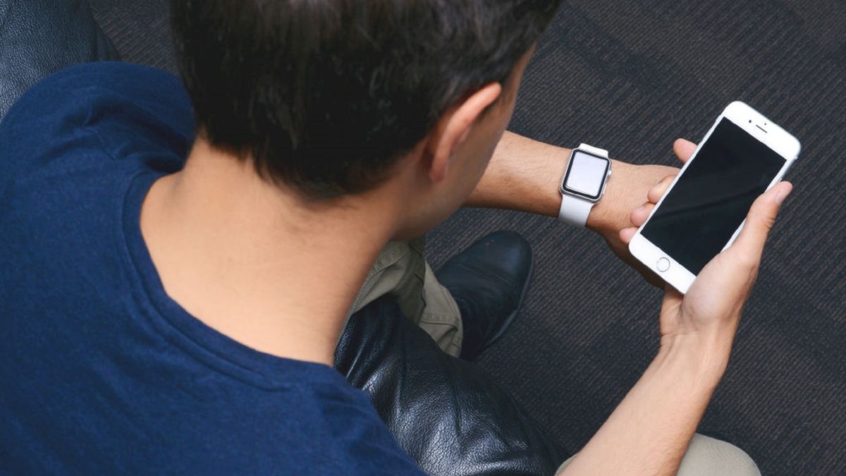 Apple iPhone 6 Product Shoot
Over-the-shoulder view of a man using an Apple iPhone 6 smartphone and Apple Watch, taken on May 12, 2015. (Photo by James Sheppard/Future via Getty Images)
Future Publishing
Colour Image, Color Image, Horizontal, Technology, One Person, People, Head And Shoulders, Male, Men, One Man Only, Sitting, looking away, Casual CLothing, T-shirt, Brown hair, Short Hair, High-angle View, Hand, Hands, Holding, Touchscreen, Studio Shot, Indoors, Apple Computers, Apple, Digital, Portable Information Device, iPhone 6, Mobile Phone, Telephone, Smart Phone, Smartphone, Apple Watch, Smartwatch, Over The Shoulder