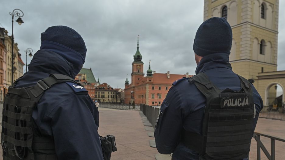 WARSAW, POLAND - FEBRUARY 21: Police officers securing Krakowskie Przedmiescie Street, where the US President will arrive for a speech at the Royal Castle, in Warsaw, Poland on February 21, 2023. President Biden is visiting Warsaw for the second time in less than a year, following a surprise visit to Kiev where he met with the Ukrainian president to bolster U.S. support for Ukraine on the eve of the one-year anniversary of the Russia-Ukraine war. (Photo by Artur Widak/Anadolu Agency via Getty Images)