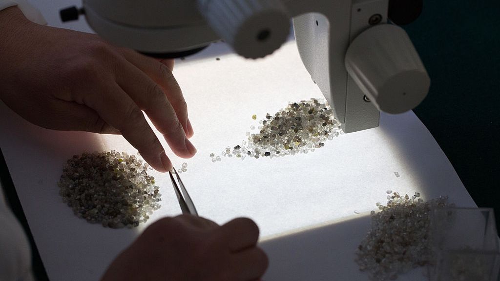 Russian Diamonds At Alrosa PJSC's Yakutsk Diamond Trading Enterprise
An employee uses tweezers to sort through a large collection of rough diamonds on a sorting table at the Yakutsk Diamond Trading Enterprise (YaPTA), operated by Alrosa PJSC, in Yakutsk, Russia, on Wednesday, Feb. 17, 2016. The world's two biggest diamond miners, De Beers and Alrosa, just sold $1 billion worth of gems and it's making smaller rivals nervous. Photographer: Andrey Rudakov/Bloomberg via Getty Images
Bloomberg
EMEA, Economy, Financial, Russia, Gem, Europe, Diamonds, Luxury, EAME, Diamond, Expensive, Economic, USSR, Gems, Minerals, Miner, Luxury Goods, Rare Earth, Mine, Spending, Mining, Mineral, Mines