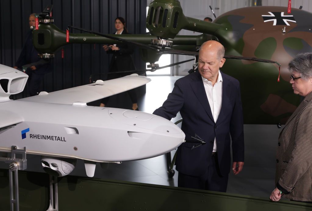 Chancellor of Germany Olaf Scholz looks at a Rheinmetall drone at the ILA Berlin Air Show 2024.