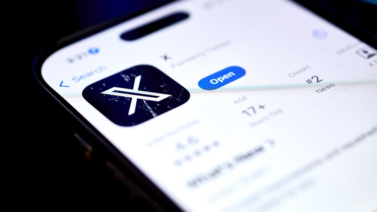 The X app in the Apple App Store on a smartphone arranged in Germantown, New York, US, on Thursday, April 24, 2025. Elon Musk's X Holdings Corp. is evolving from a social media platform powered by mainstream advertisers to one betting on dollars generated from artificial intelligence and subscriptions, a change that appears to have buoyed its revenue lately. Photographer: Gabby Jones/Bloomberg via Getty Images