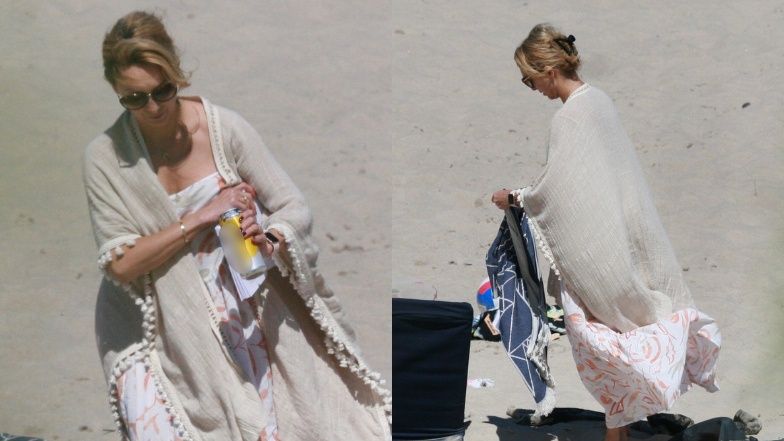 Anna Kalczyńska pije piwo na plaży i fotografuje pociechy