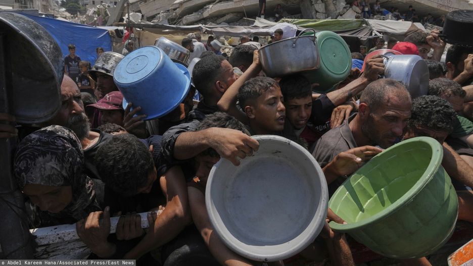 Temporary
Palestinians struggle to get donated food at a community kitchen, in Gaza City, northern Gaza Strip, Saturday, July 26, 2025. (AP Photo/Abdel Kareem Hana)
Abdel Kareem Hana