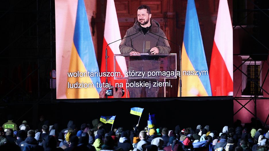 The speech of President of Ukraine Volodymyr Zelensky is displayed near the Royal Castle during the visit of Ukrainian President in Warsaw, Poland on April 5, 2023. (Photo by Jakub Porzycki/NurPhoto via Getty Images)