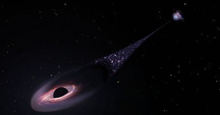 Przez kosmos pędzi czarna dziura. Ciągnie za sobą "towarzyszy"