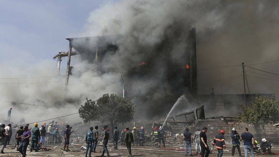Temporary
Firefighters extinguish flames as smoke rises from Surmalu market about two kilometers (1.2 miles) south of the center Yerevan, Armenia, Sunday, Aug. 14, 2022. A strong explosion at a fireworks storage area has ripped through a market in Armenia's capital. At least one person has been killed and about 20 others have been injured. The blast on Sunday set off a large fire. (Vahram Baghdasaryan/Photolure via AP)
PHOTOLURE