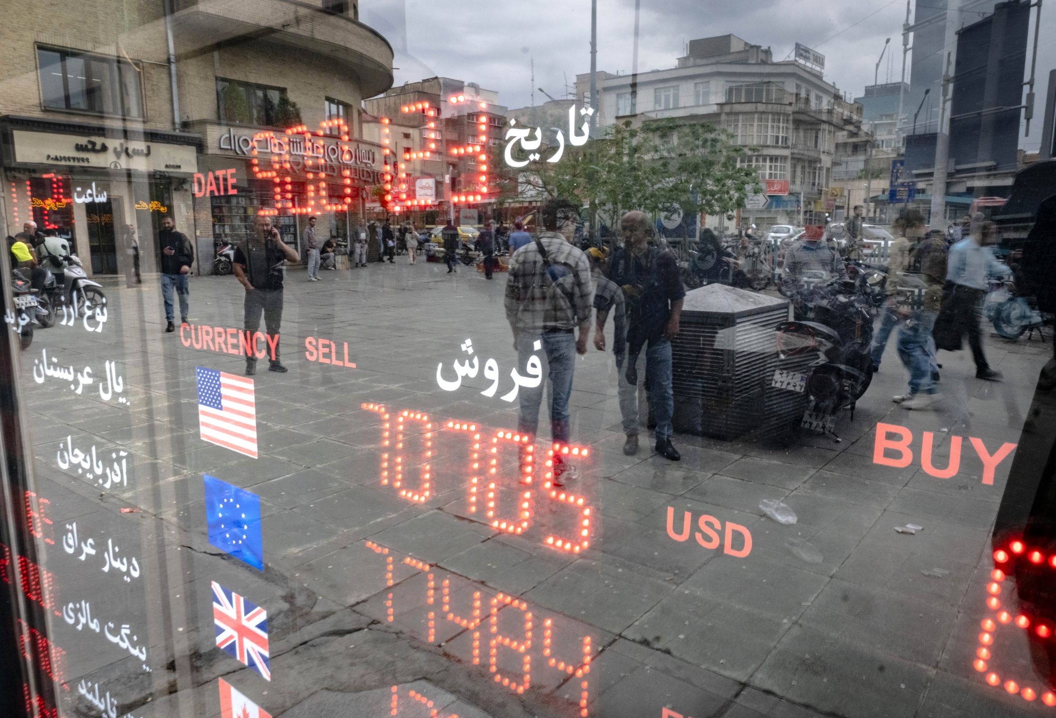 An electronic board is displayed outside a currency exchange shop in downtown Tehran, Iran, on April 12, 2025, during the day of the Iran-U.S. nuclear discussions. According to Iranian officials, indirect nuclear discussions between Iran and the United States begin in Muscat, the capital of Oman, on April 12. (Photo by Morteza Nikoubazl/NurPhoto via Getty Images)