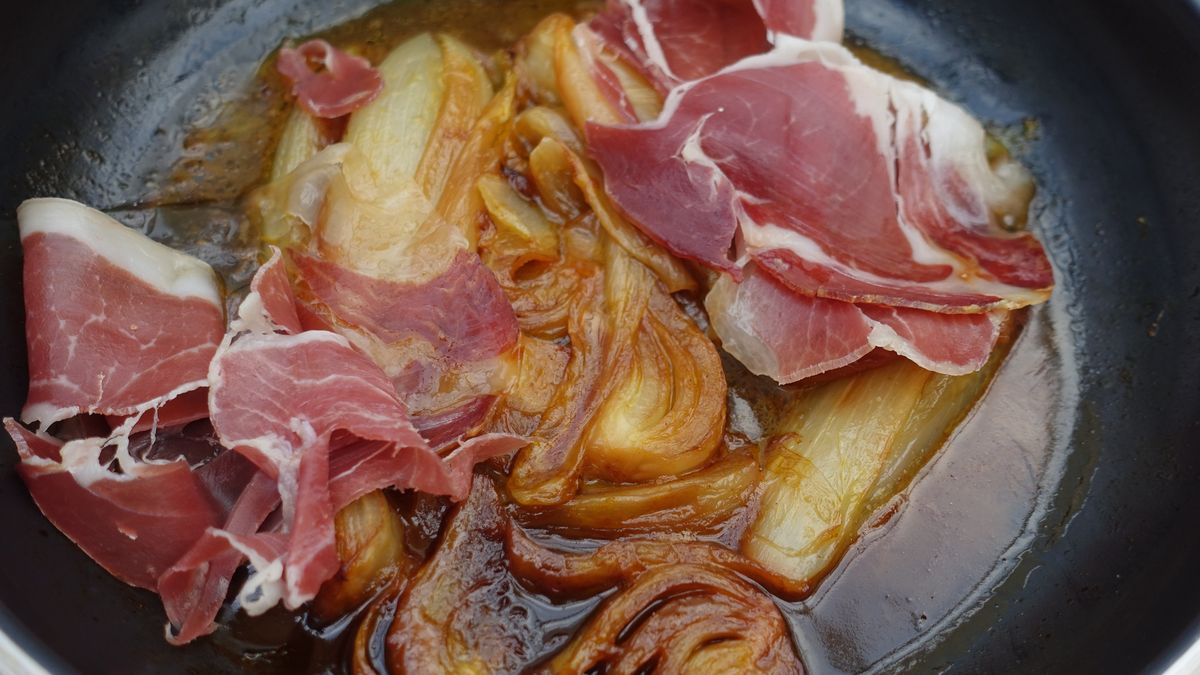 Endives and fennel in portions hash brown in orange juice with raw ham  French gastronomyEndives and fennel in portions hash brown in orange juice with raw ham  French gastronomynobtis