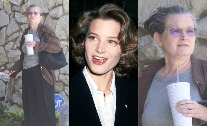 Odmieniona Bridget Fonda na spacerze z psem