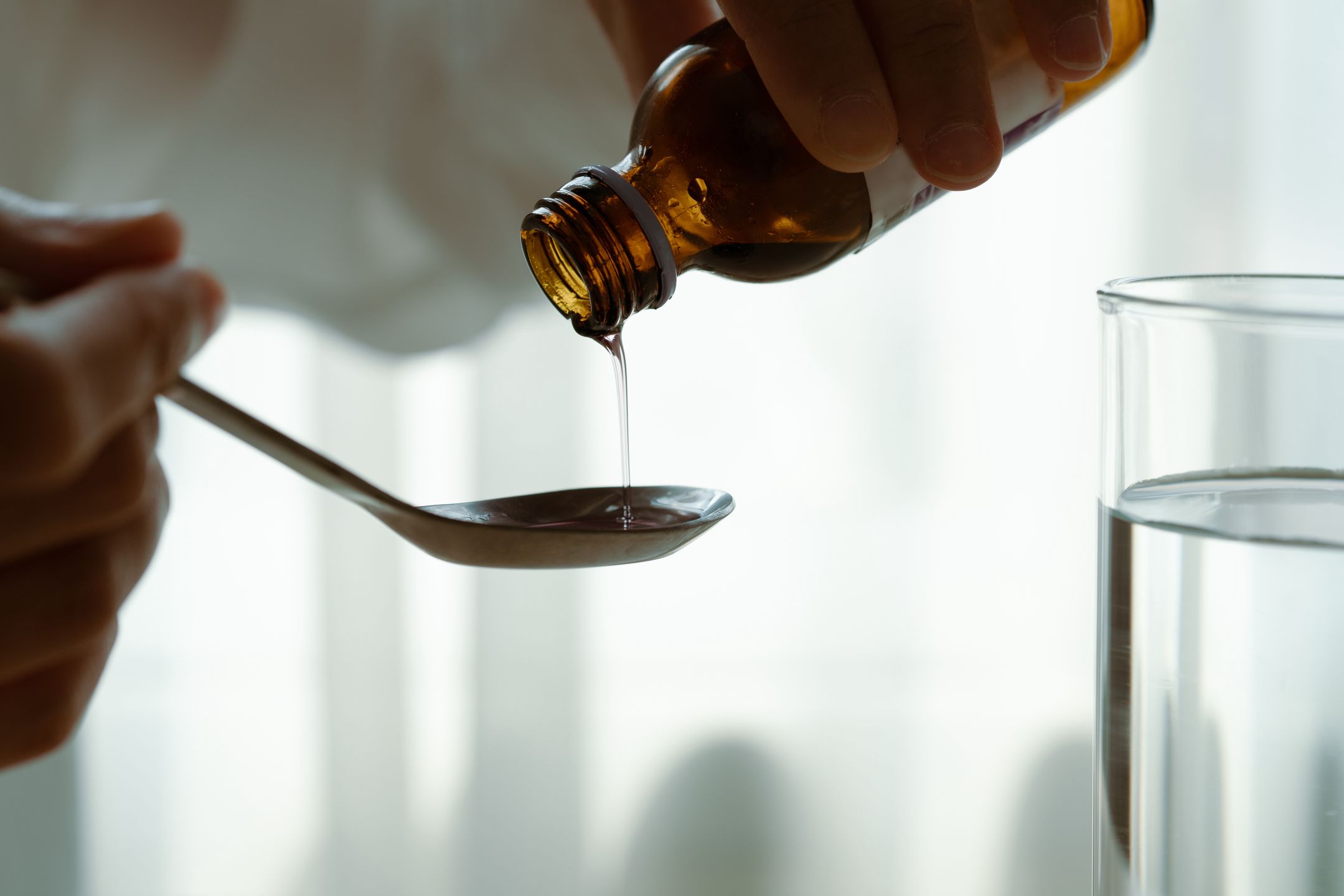 Woman hand pouring medication or cough syrup from bottle to spoo
Cavan Images
alcohol, baby, background, beverage, cold, concept, cough, cure, disease, drug, female, flu, foreground, girl, glass, health, healthcare, healthy, ill, little, medical, medication, person, pour, sick, sickness, treatment, unhealthy, unwell, white, woman