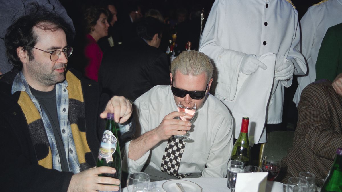 English radio DJ Danny Baker (left) and English footballer Paul Gascoigne attend the Television and Radio Industries Club (TRIC) awards at the Grosvenor House Hotel, London, March 1997. (Photo by Dave Benett/Getty Images)