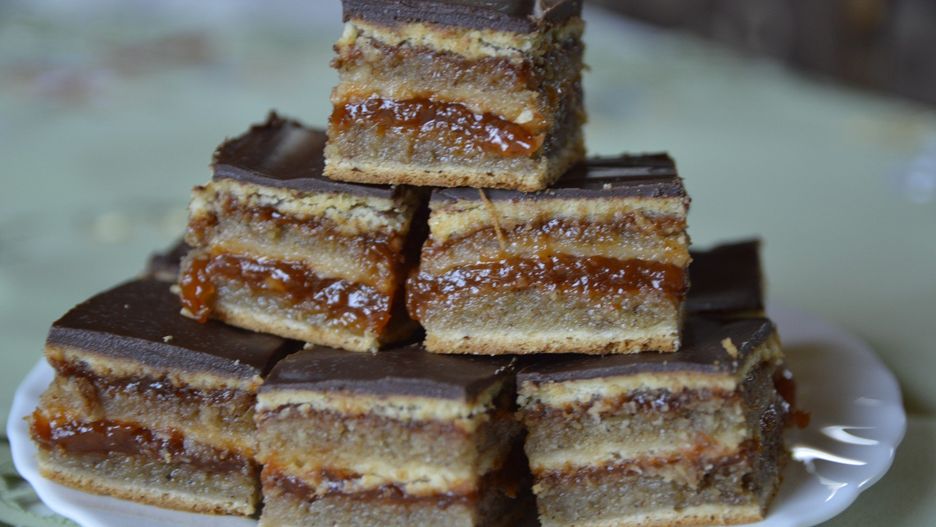 slices of Hungarian Gerbeaud Cake on the white plate close up