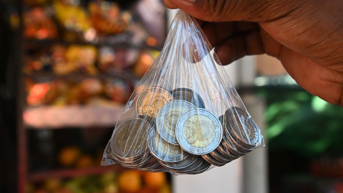 A bag of South African rand coins arranged outside a street vendor's stall in the Sandton district of Johannesburg, South Africa, on Friday, May 12, 2023. The rand slumped to its weakest level on record against the dollar and government bond yields soared as a diplomatic row between South Africa and the US simmered, putting trade of as much as 400 billion rand ($21 billion) at risk. Photographer: Leon Sadiki/Bloomberg via Getty Images