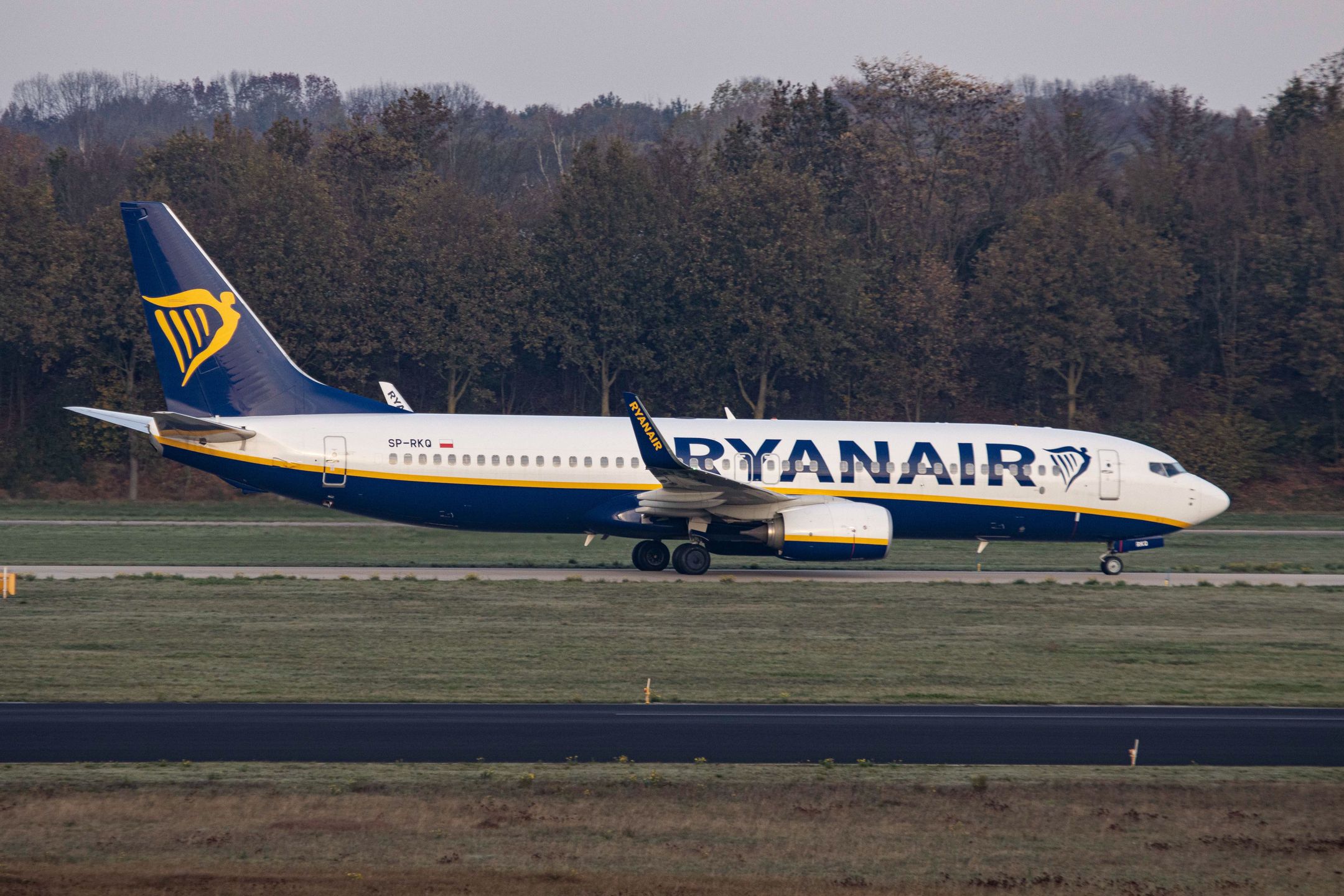 A Ryanair Boeing 737-800 aircraft as seen on final approach flying, touching down and taxiing in Eindhoven EIN EHEH Airport in the Netherlands. The narrow body airplane has the registration SP-RKQ and belongs to Buzz Airline,  a Polish carrier headquartered in Warsaw. Formerly called Ryanair Sun a subsidiary of the Irish low cost budget airline company Ryanair. The flights and passenger traffic in Eindhoven is reduced because of the Covid-19 Coronavirus pandemic and the lockdowns applied in multiple European Countries. Eindhoven, Netherlands on November 8, 2020 (Photo by Nicolas Economou/NurPhoto via Getty Images)