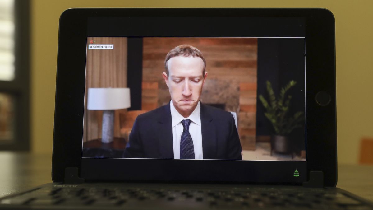 Mark Zuckerberg, chief executive officer of Facebook Inc., speaks virtually during a House Energy and Commerce Subcommittees hearing on a tablet computer in Princeton, Illinois, U.S., on Thursday, March 25, 2021. The chief executives of Facebook, Google, and Twitter are testifying as lawmakers on both sides of the aisle prepare to press the companies over the spread of false information that contributed to the deadly Jan. 6 Capitol attacks. Photographer: Daniel Acker/Bloomberg via Getty Images