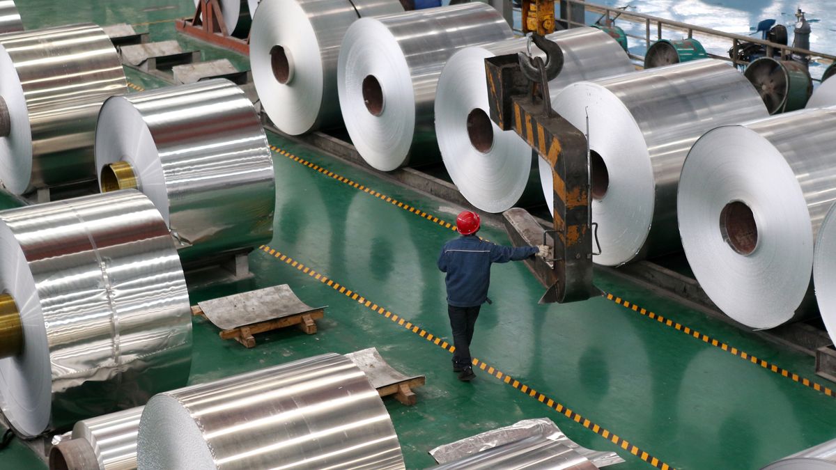CHONGQING, CHINA - FEBRUARY 28: An employee controls a crane to lift an aluminum coil at a factory on February 28, 2023 in Chongqing, China. (Photo by Yang Min/VCG via Getty Images)