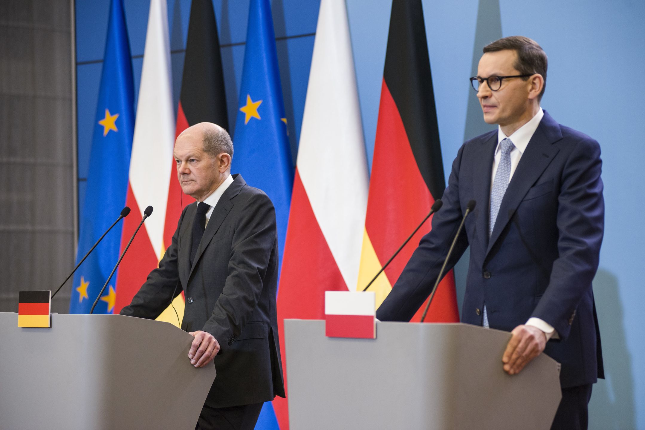 WARSAW, POLAND - 2021/12/12: Olaf Scholz (L), and Mateusz Morawiecki (R) seen speaking during a press conference.Four days after taking office, German Chancellor Olaf Scholz paid an inaugural visit to neighboring Poland on Sunday 12th of December. Olaf Scholz was welcomed by Polish Prime Minister Mateusz Morawiecki. After political talks, Olaf Scholz and Mateusz Morawiecki attended a press conference at the Prime Minister's Chancellery. (Photo by Attila Husejnow/SOPA Images/LightRocket via Getty Images)