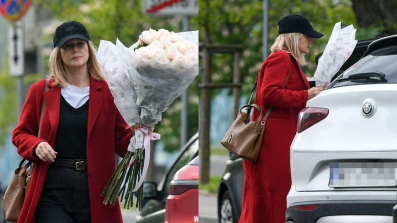 Obładowana bukietami róż Grażyna Torbicka zadaje szyku w KRWISTYM płaszczu i z torebką za prawie 2 tysiące złotych (ZDJĘCIA)